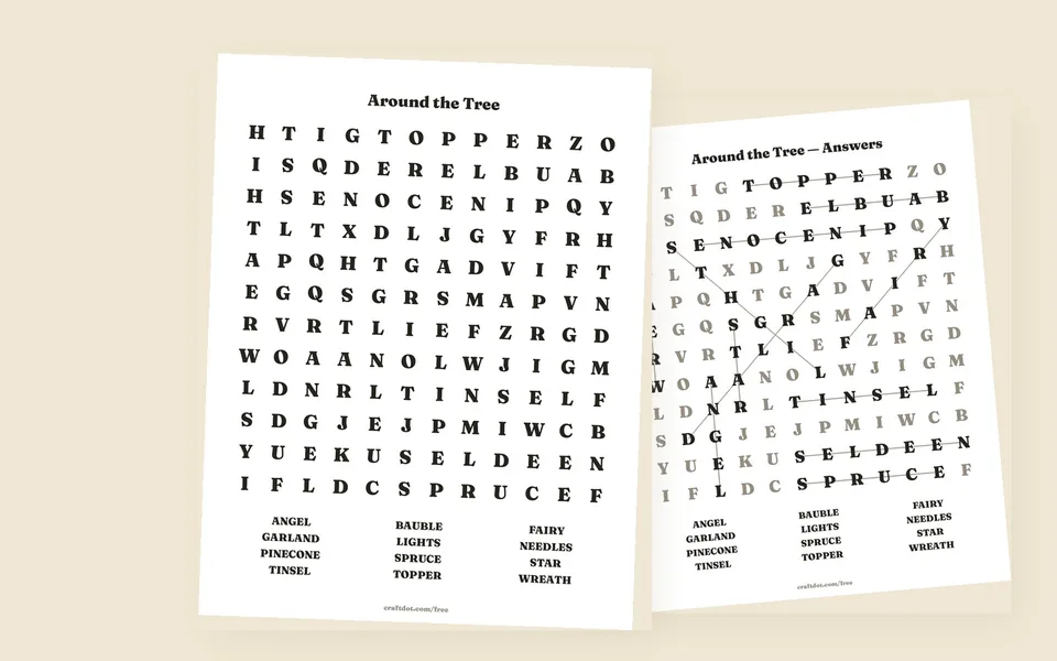 Two printed sheets on a warm paper-coloured surface. The front one is headed Around the Tree, twelve big black capitals to a row with the word list — angel, garland, pinecone, tinsel and eight more — set underneath in three columns. Behind it sits the answer sheet, where the found words stay solid black with a line drawn through each and every other letter has faded to a soft grey.
